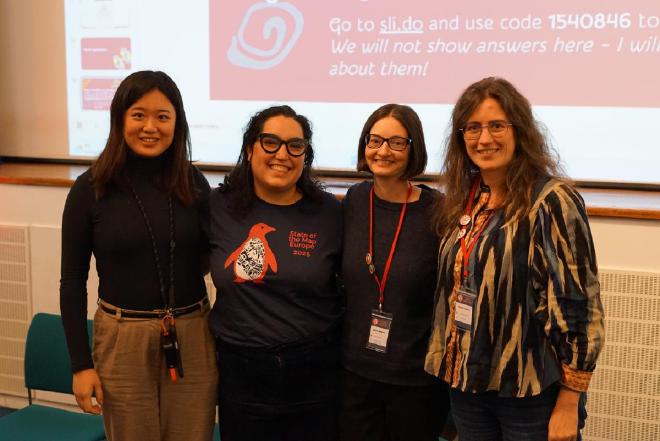 Sophia Chen, Gala Camacho, Nicole Siggins, and Maria Longley smile for the camera after their panel discussion.